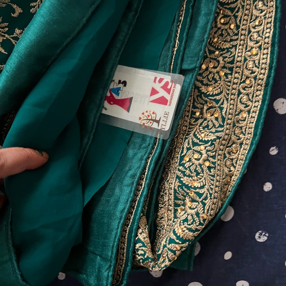 Beautiful bottle green saree with blouse piece attached